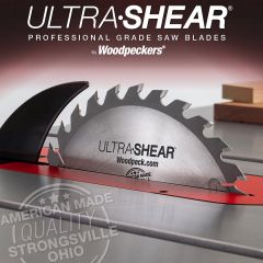 Ultra-Sheare 30-Tooth Glue Line Rip Blade in table saw with finished cuts in background.
