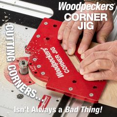 Woodpeckers Corner Jig in use on router table cutting 2-1/2" radius corner.