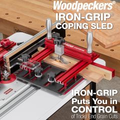 Iron-Grip Coping Sled on Woodpeckers router table making end-grain coping cut on cabinet door.
