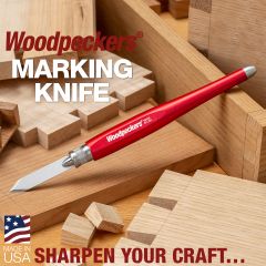 Woodpeckers Marking Knife resting on a pile of hand cut dovetail joints and boxes.