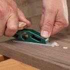 Blue Spruce Chisel Plane trimming plugs in a workpiece.
