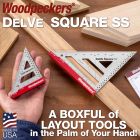 Both sizes of the DelVe Square SS. The larger is resting on a board with a 45-degree mark made. The smaller is resting in the palm of the user's hand. 