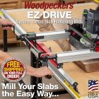 Image of controls on EZ-Drive System. Hands on cranks feeding router carriage over natural edge slab.