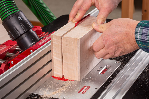 Slip a quarter-inch spacer into the groove before you make the last cut.