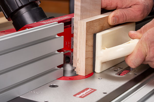Keep stock vertical through cutter with push block.